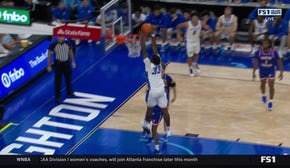 Fredrick King soars for a strong two-handed alley-oop to extend No. 14 Creighton's lead over HCU